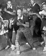 George Snowden. A.k.a. Shorty George. The almost five-foot tall dancer was known for his exaggerated and intricate footwork. His signature move was to bend his knees and swing them from side to side, exemplifying the fact that he was close to the floor.